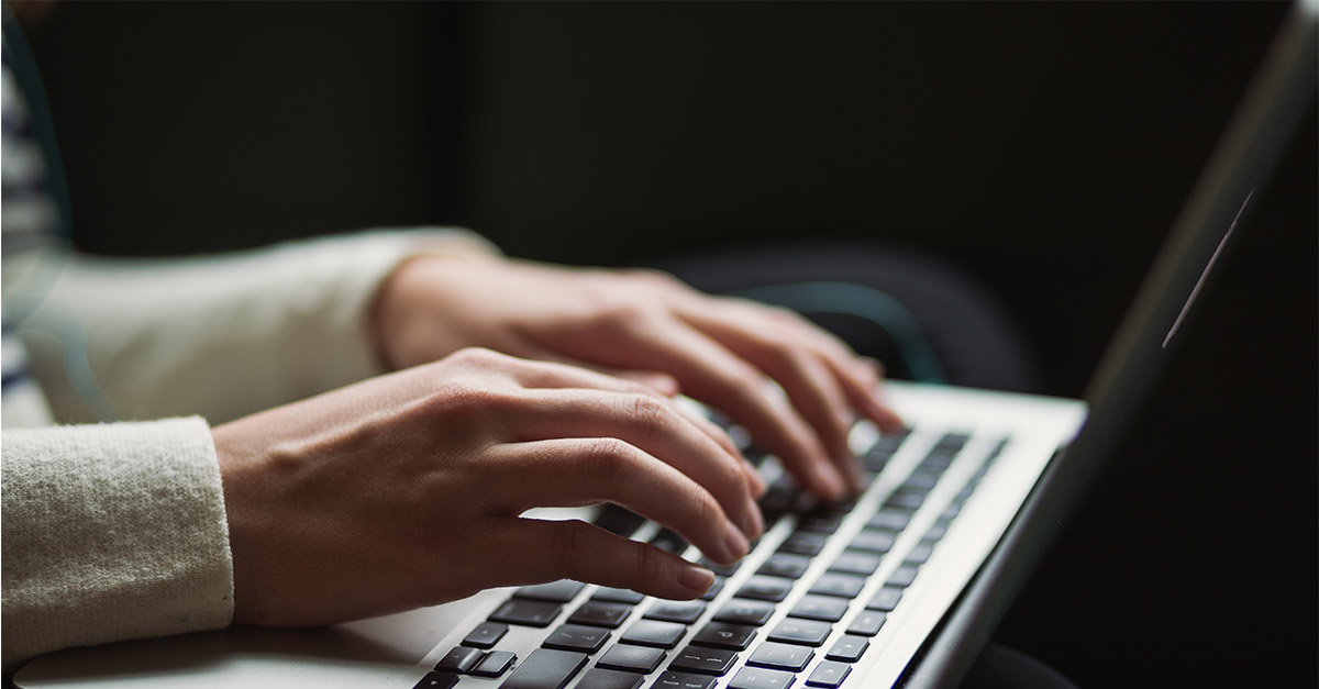 office worker working on laptop